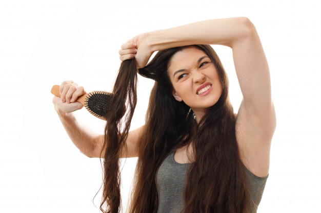 Woman struggling with her hair