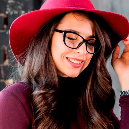 portrait smiling beautiful young woman with pink hat black eyeglasses 1