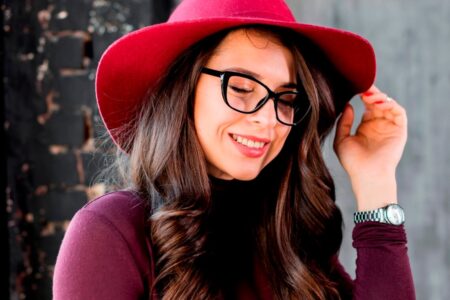 portrait smiling beautiful young woman with pink hat black eyeglasses 1