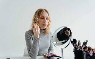 Free Woman Holding Eye Makeup Brush Stock Photo