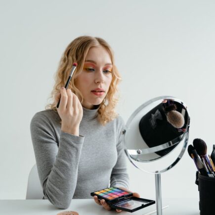 Free Woman Holding Eye Makeup Brush Stock Photo