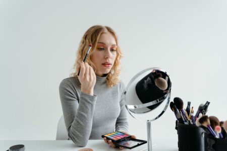 Free Woman Holding Eye Makeup Brush Stock Photo